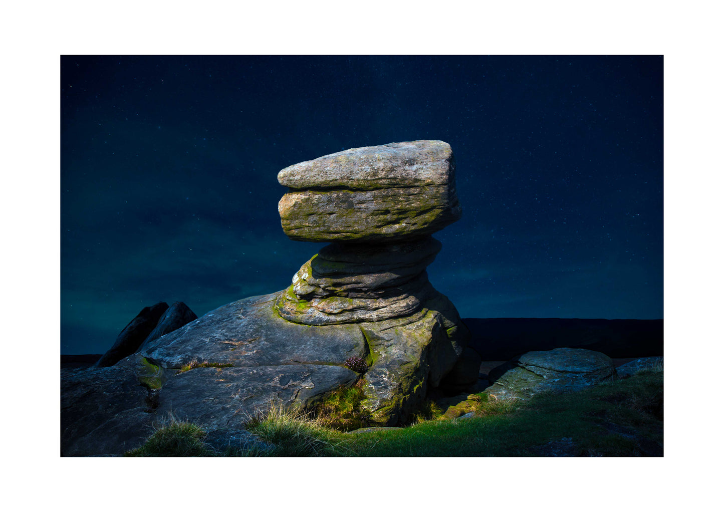 Stack of stones with a dark blue sky A3 print