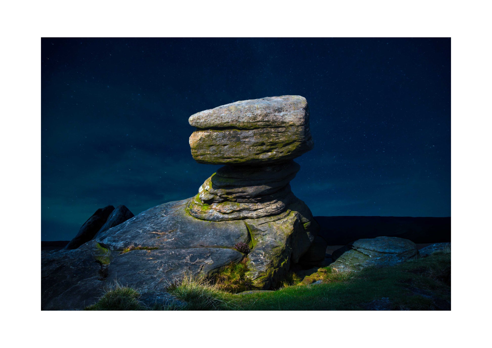 Stack of stones with a dark blue sky A3 print