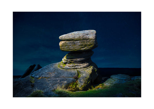 Stack of stones with a dark blue sky A3 print